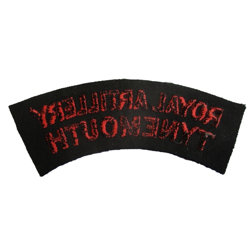 194 - Royal Artillery Tynemouth cloth shoulder title, circa 1952-56, red embroidered lettering on dark blu... 