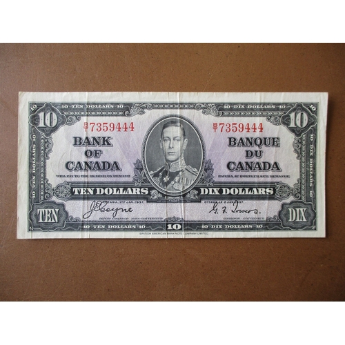 261 - World collection in album with Isle of Man, Canada 1937 $10 Coyne/Towers very fine, 1989 $10 uncircu... 