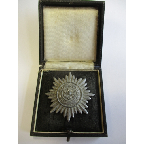 76 - Third Reich. Ostvolk Decoration For Merit 1st Class without swords, nearly extremely fine in box of ... 