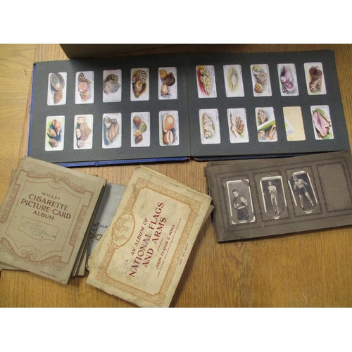 17 - Collection of loose, in cigarette card boxes and paper albums including ranges from Churchman, Galla... 