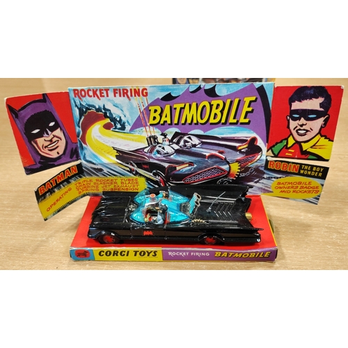 218 - Corgi. Batmobile No.267 black with red bat logos to wheel hubs, includes both Robin and Batman figur... 