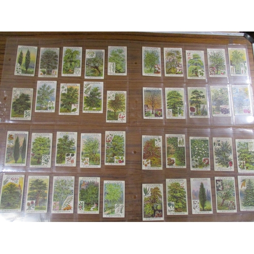 22 - Gallaher. Complete set in plastic sleeves with Woodland Trees Series, generally good. Cat. £500. (Se... 