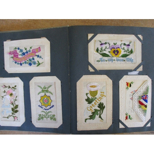 62 - Misc. coln. in old album and loose. French religious theme woven silks (2), embroidered silks in mxd... 