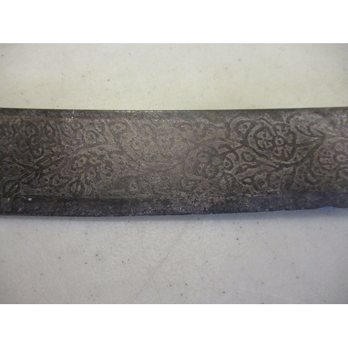 133 - Afghan pulwar, probably 19th century, 80cm curved blade 70% ornately etched with floral design to bo... 