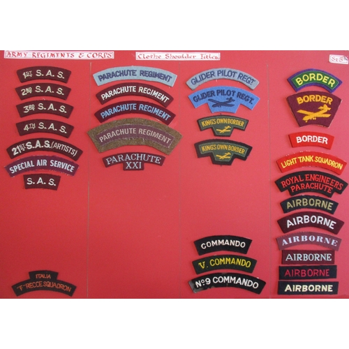 148 - Cloth shoulder title collection mounted on 2 boards with double sided tape. Mainly embroidered lette... 