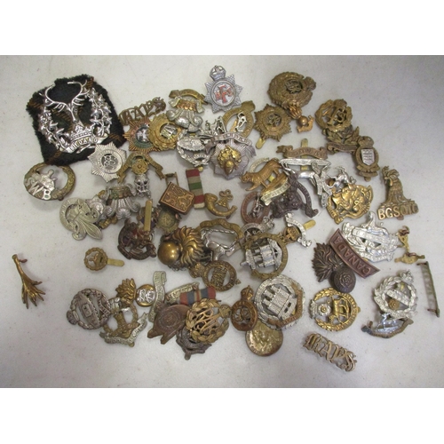 162 - Collection of mainly cap badges including WW2 economy Royal Marines by Stanley & Sons, RAOC, a few C... 