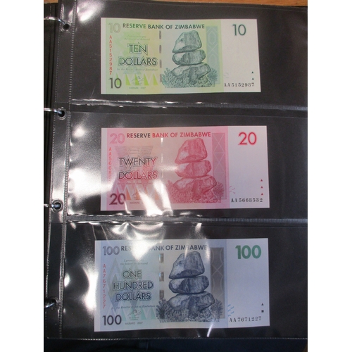 276 - Collection of mostly Africa and Oceania banknotes in 3 albums, largely mid to late 20th century, gen... 