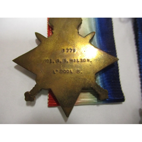 3 - Family range with:
1. WW1 1914-15 Star trio and WW2 Defence Medal to 2 Lieut A.S. Wilson (1779 Pte A... 