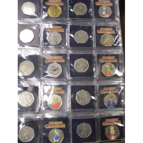 747 - Collection in 3 Change Checker albums with £2, £1, 50'ps including 2009 Kew Gardens 50p (2), crowns,... 