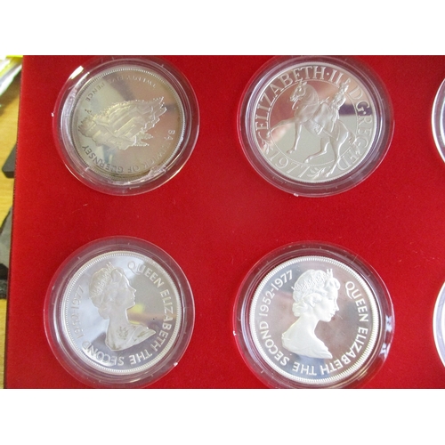 902 - 1977 Silver Jubilee proof cased set of 8 by Spink, mainly FDC, odd with slight discolouration. (R)