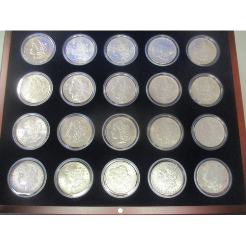 928 - USA. Range of Morgan Dollars in wooden case, generally extremely fine to near uncirculated, with 187... 