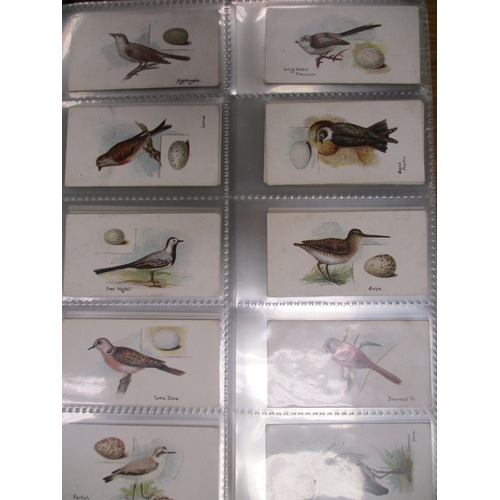 13 - Collection in 4 albums with complete sets including L&B Birds and Eggs, Mitchell Army Ribbons & Butt... 