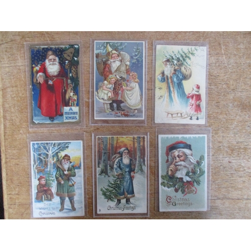 130 - Greetings. A coln. of Father Christmas cards with red robes, green, blue, brown and white (see photo... 