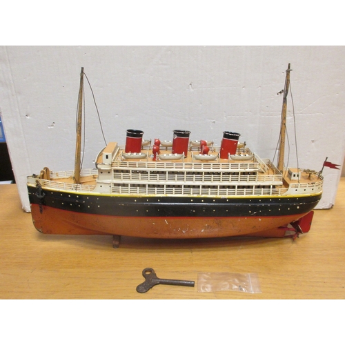 152 - Bing. Tinplate clockwork (with key) three funnelled ocean liner, 400mm x 9mm, red/ black hull with w... 