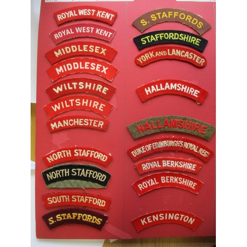 78 - Infantry cloth shoulder title collection mounted on 4 boards with double sided tape. Mainly embroide... 