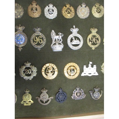 75 - Cap badge collection of mostly Infantry regiments and Royal Engineers including QV mounted on foam i... 