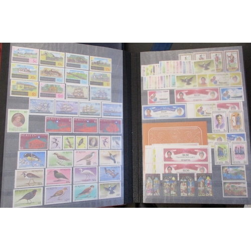 155 - St. Kitts-Nevis. QEII mint coln in 2 stockbooks, though much of the earlier part of the coln (c.up t... 