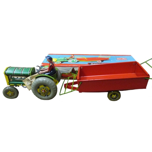 114 - Mettoy Playthings. Mechanical Tractor and Trailer No 3262/76 generally good in good plus box. (B)