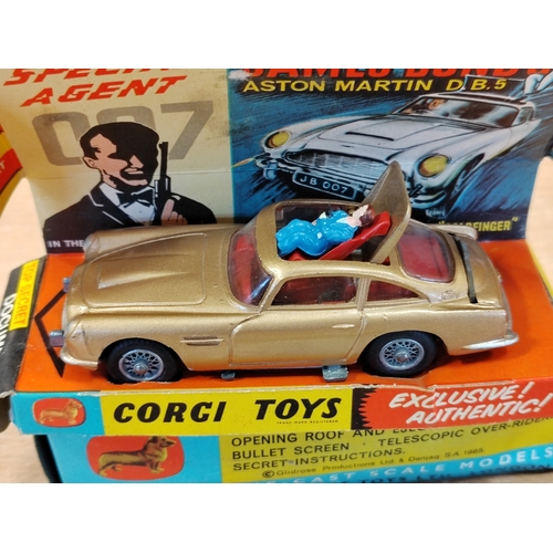 243 - Corgi. James Bond Aston Martin D.B.5 No.265 with working retractable machine guns, opening roof and ... 