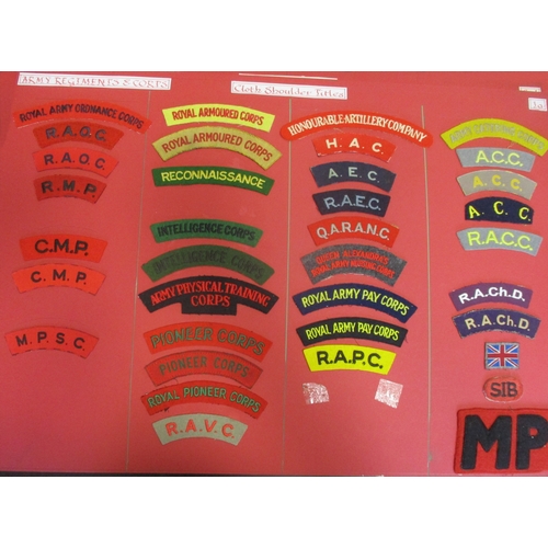 71 - Cloth shoulder title collection mounted on 5 boards with double sided tape, in a carrying case. Main... 