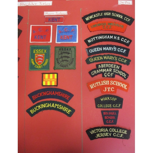 71 - Cloth shoulder title collection mounted on 5 boards with double sided tape, in a carrying case. Main... 