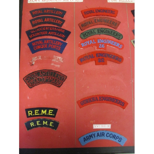 71 - Cloth shoulder title collection mounted on 5 boards with double sided tape, in a carrying case. Main... 