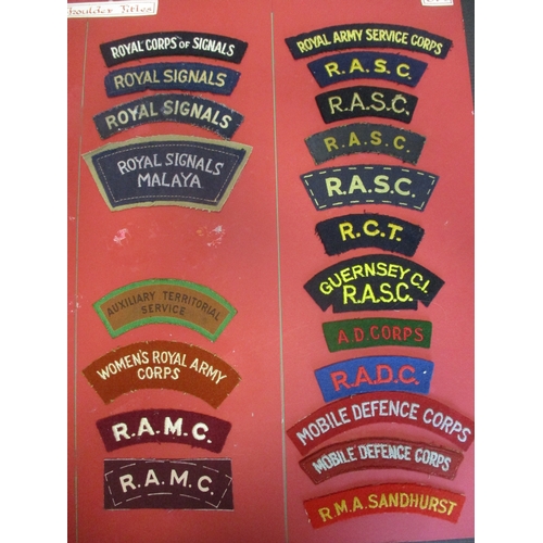 71 - Cloth shoulder title collection mounted on 5 boards with double sided tape, in a carrying case. Main... 