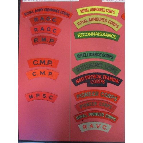 71 - Cloth shoulder title collection mounted on 5 boards with double sided tape, in a carrying case. Main... 