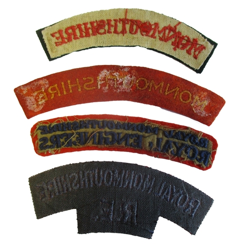 82 - Monmouthshire cloth shoulder title range with:
1. Monmouthshire, red embroidered lettering on dark g... 