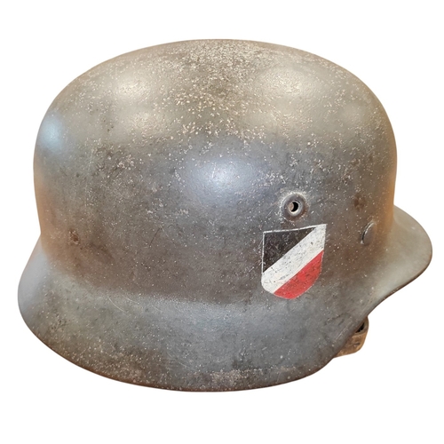 56 - WW2 German Army M-35 Pattern double decal steel combat helmet, complete with lining and strap, origi... 