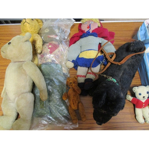 134 - Collection of dolls, including plastic and knitted, some in carriers, teddies and accessories plus A... 
