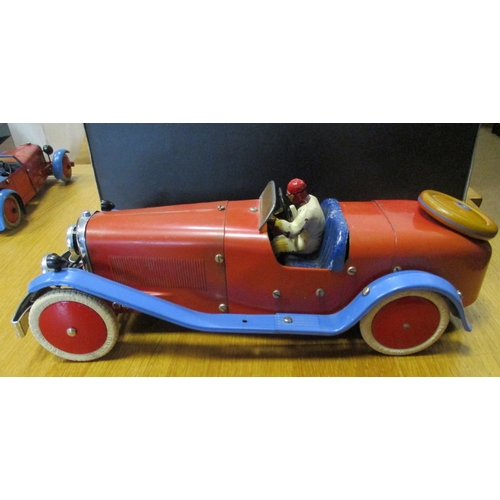142 - Meccano. Tinplate constructor car with figure, red body, powder blue mud guard, red hubs, white whee... 