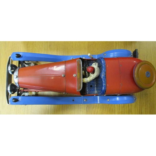 142 - Meccano. Tinplate constructor car with figure, red body, powder blue mud guard, red hubs, white whee... 