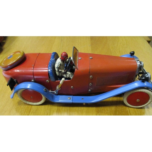 142 - Meccano. Tinplate constructor car with figure, red body, powder blue mud guard, red hubs, white whee... 