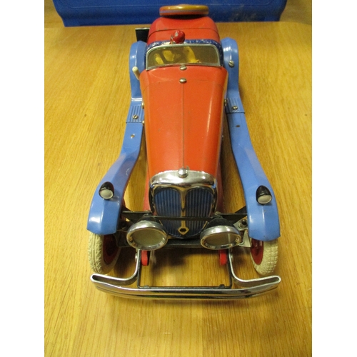 142 - Meccano. Tinplate constructor car with figure, red body, powder blue mud guard, red hubs, white whee... 