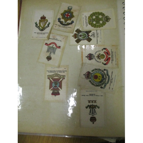 19 - Collection in albums and sleeves with Phillips silks including City Arms, Heraldic Series, Regimenta... 
