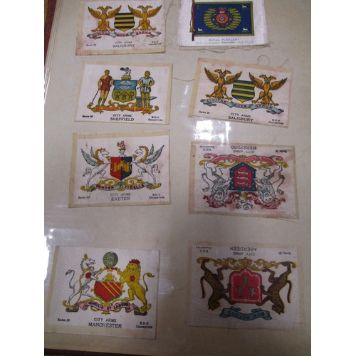 19 - Collection in albums and sleeves with Phillips silks including City Arms, Heraldic Series, Regimenta... 