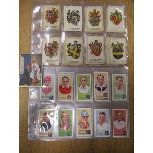 19 - Collection in albums and sleeves with Phillips silks including City Arms, Heraldic Series, Regimenta... 