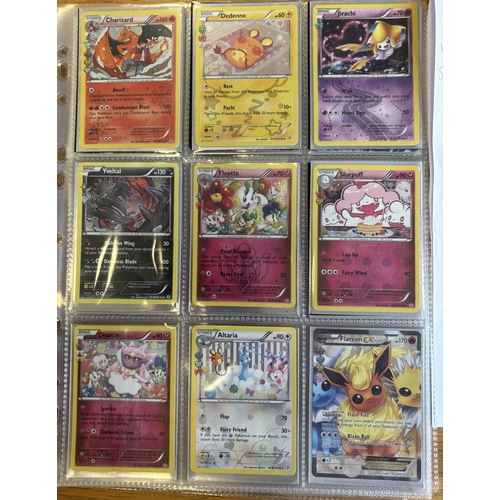 43 - Pokemon. Collection in 3x3 card storage sleeves, generally near mint, including Generations MChariza... 