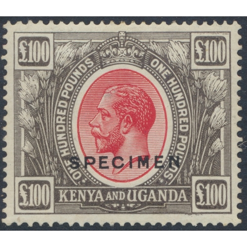 Kenya, Uganda, and Tanganyika. 1922-7 £100 red and black ovpt SPECIMEN, M with partial hinge remainder. Fairly well-centred, though noting tiny repaired corner fault at top left, and a few upper perfs showing small tone spots at reverse (caused by partial hinge remainder). Also small area of slight darkening to King's forehead (possibly a small stain). A very presentable example of a very scarce, high-value item in spite of these minor faults. (SG 105s) Cat £6,000 (S)