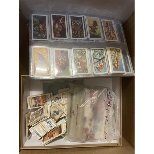 134 - Accumulation of cigarette cards and postcards, loose, in albums and paper albums, generally fair to ... 