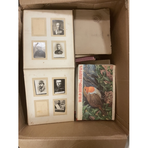 134 - Accumulation of cigarette cards and postcards, loose, in albums and paper albums, generally fair to ... 