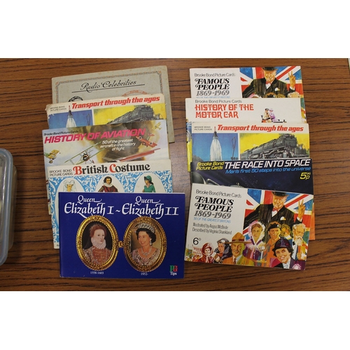 136 - Accumulation of cigarette cards and postcards, mostly loose, with some in tins and stock books, gene... 