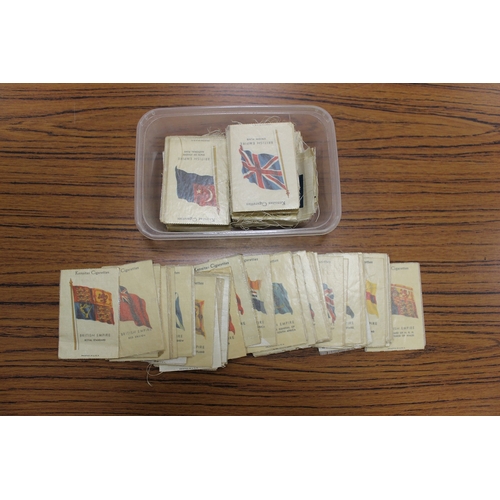 136 - Accumulation of cigarette cards and postcards, mostly loose, with some in tins and stock books, gene... 