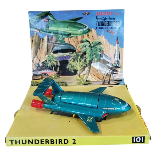 Dinky. Thunderbird 2 - finished in green, yellow legs, chrome and red thrusters, complete with Thunderbird 4 in Pod No.101, near excellent in good box. (T)