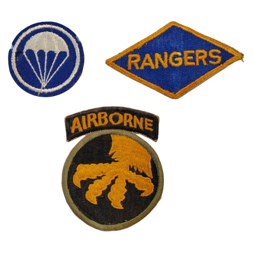 113 - Range of WW2 U.S. patches with Ranger patch, U.S. Army Parachute Infantry cap badge and 17th Airborn... 