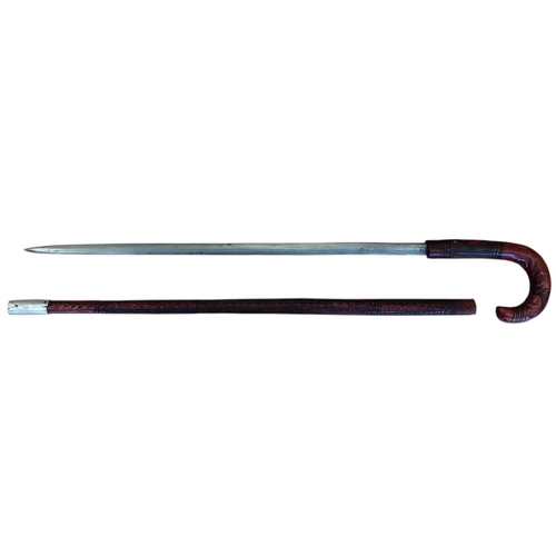 65 - Somali stick sword, dark red leather, crook style handle, pitting to blade, about good very fine. BU... 