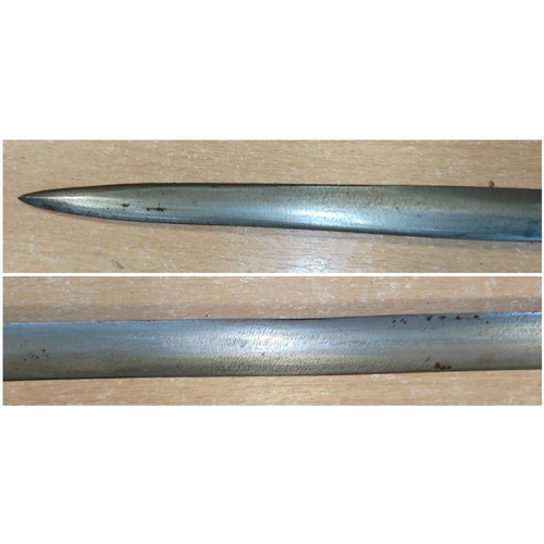 65 - Somali stick sword, dark red leather, crook style handle, pitting to blade, about good very fine. BU... 