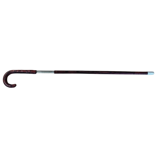 67 - Somali stick sword, dark red leather, crook style handle, sword is stiff in scabbard and difficult t... 