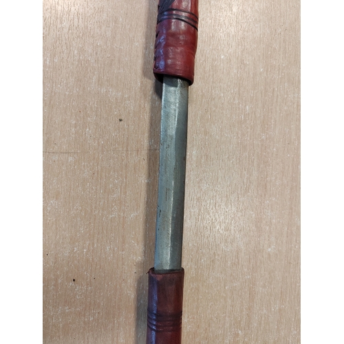 67 - Somali stick sword, dark red leather, crook style handle, sword is stiff in scabbard and difficult t... 